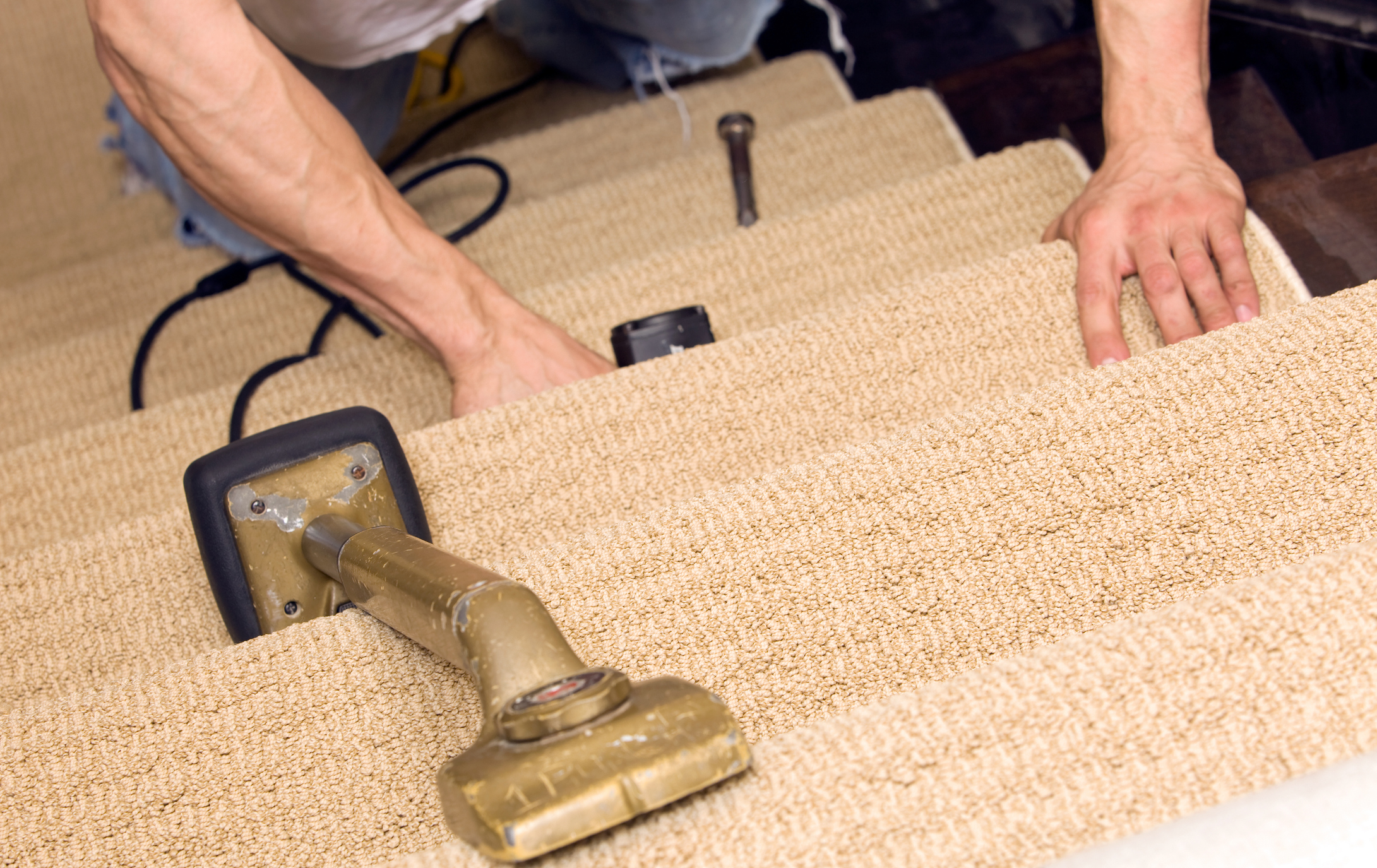 Professional carpet installation by Lewis Flooring - carpet stretching process